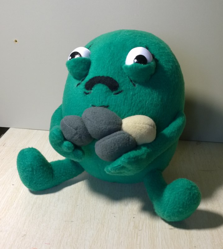 Gallbladder plush clutching his stones, handmade Custom gallbladder plush clutching his gallstones, sad white eyes and stitched frown, sewn by hand to order