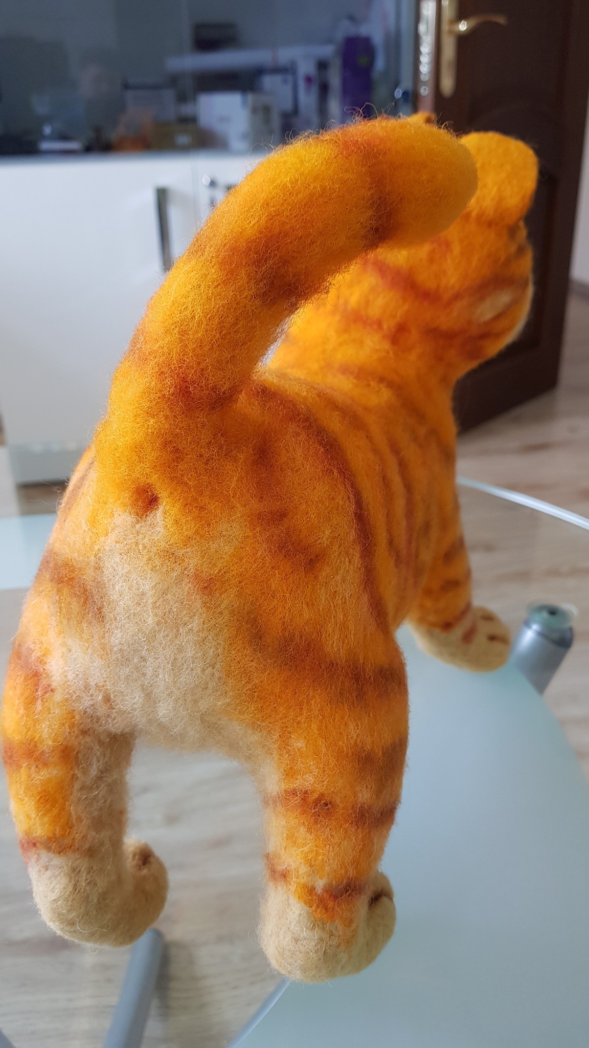 Garfield plush with a raised striped tail and rust stripes on the back, felted wool, made to order