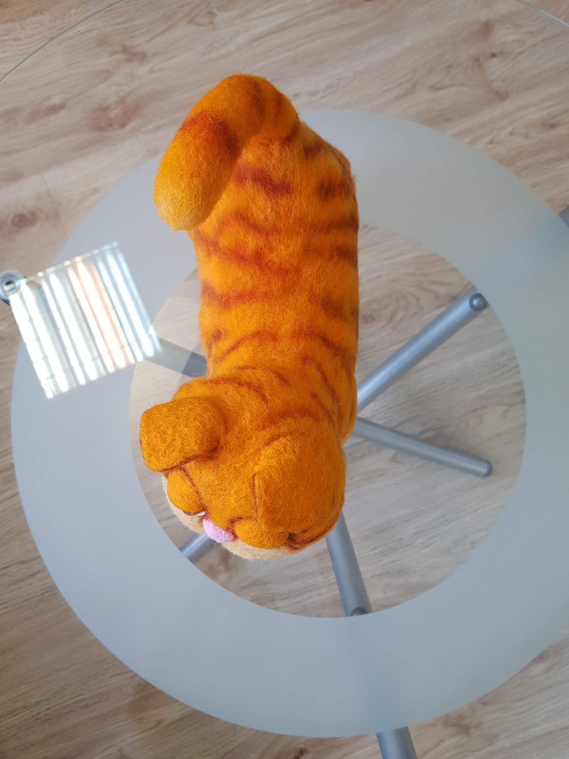 Felted Garfield plush with tabby stripes on the back Felted Garfield plush seen from above: orange back with dark tabby stripes, ears and tail, made to order