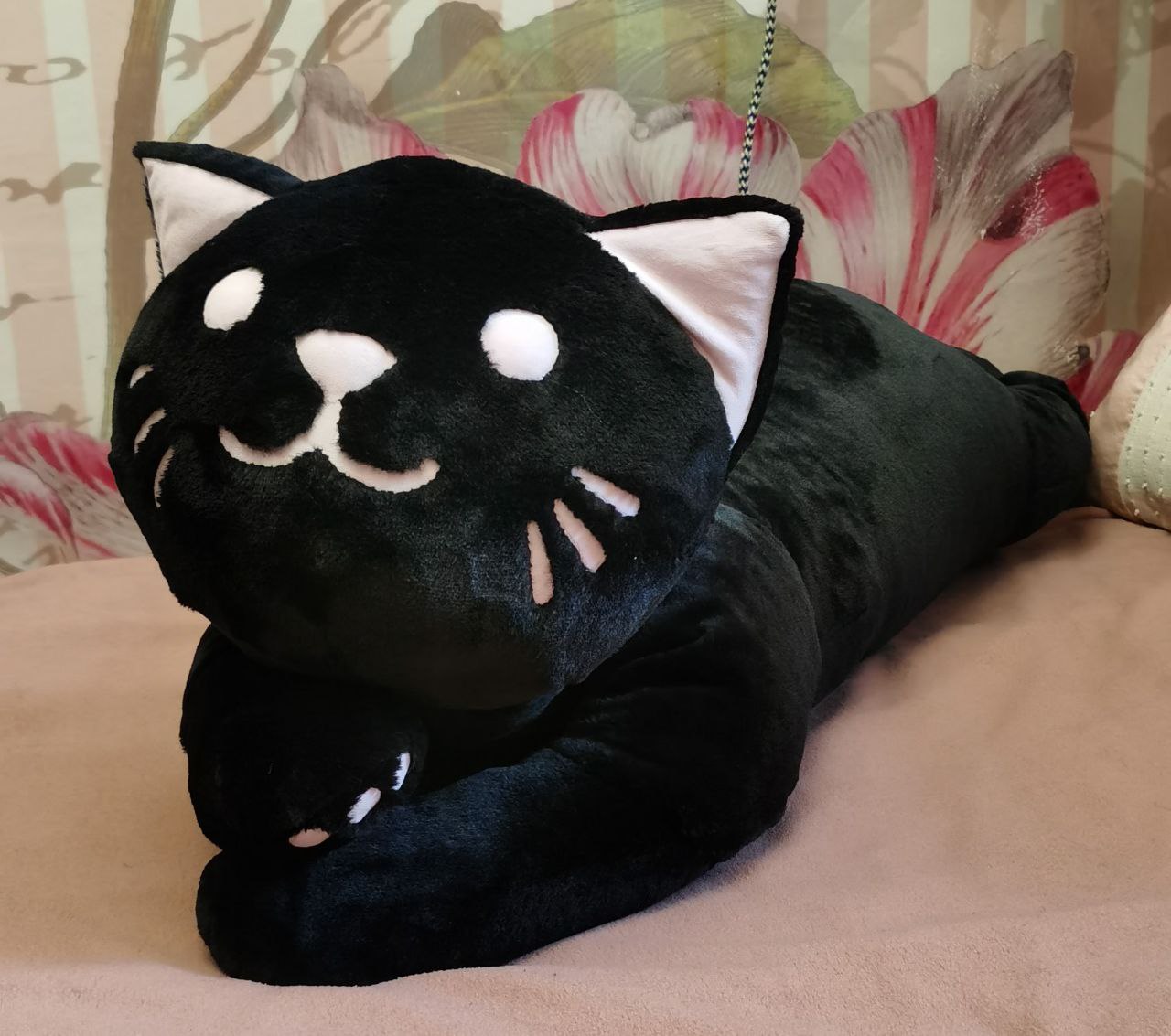 Giant black cat plush, made to order Giant black cat plush made to order, smiling face with white eyes and pink nose over crossed black paws
