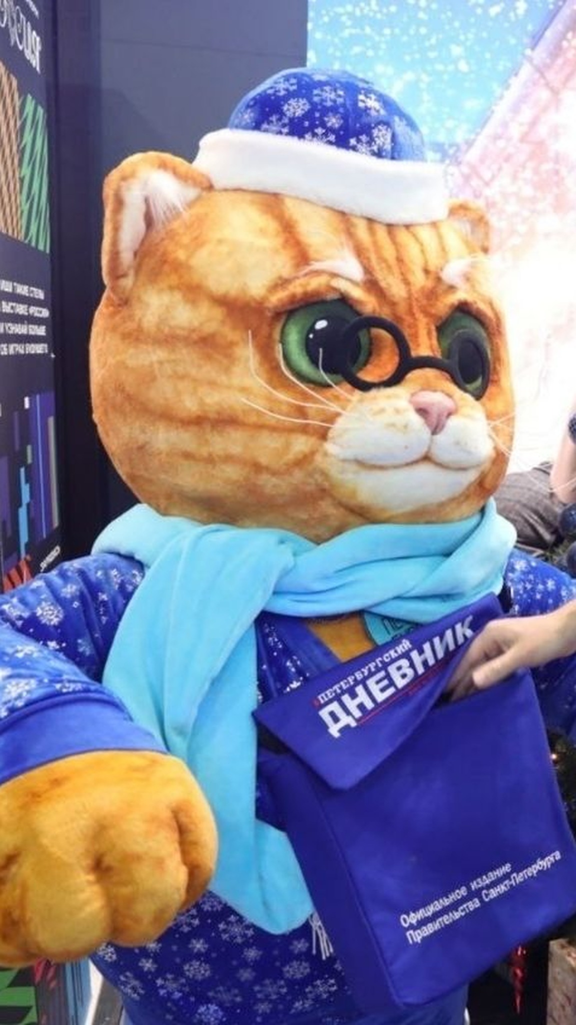 Giant plush cat mascot at a New Year exhibition stand, a visitor drops a postcard into its bag, made to order