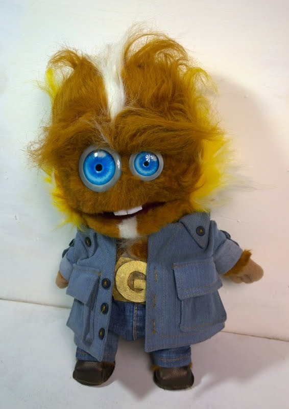 Ginger monster puppet with a G buckle Ginger monster puppet with mismatched blue eyes, two buck teeth and a gold G belt buckle, made to order
