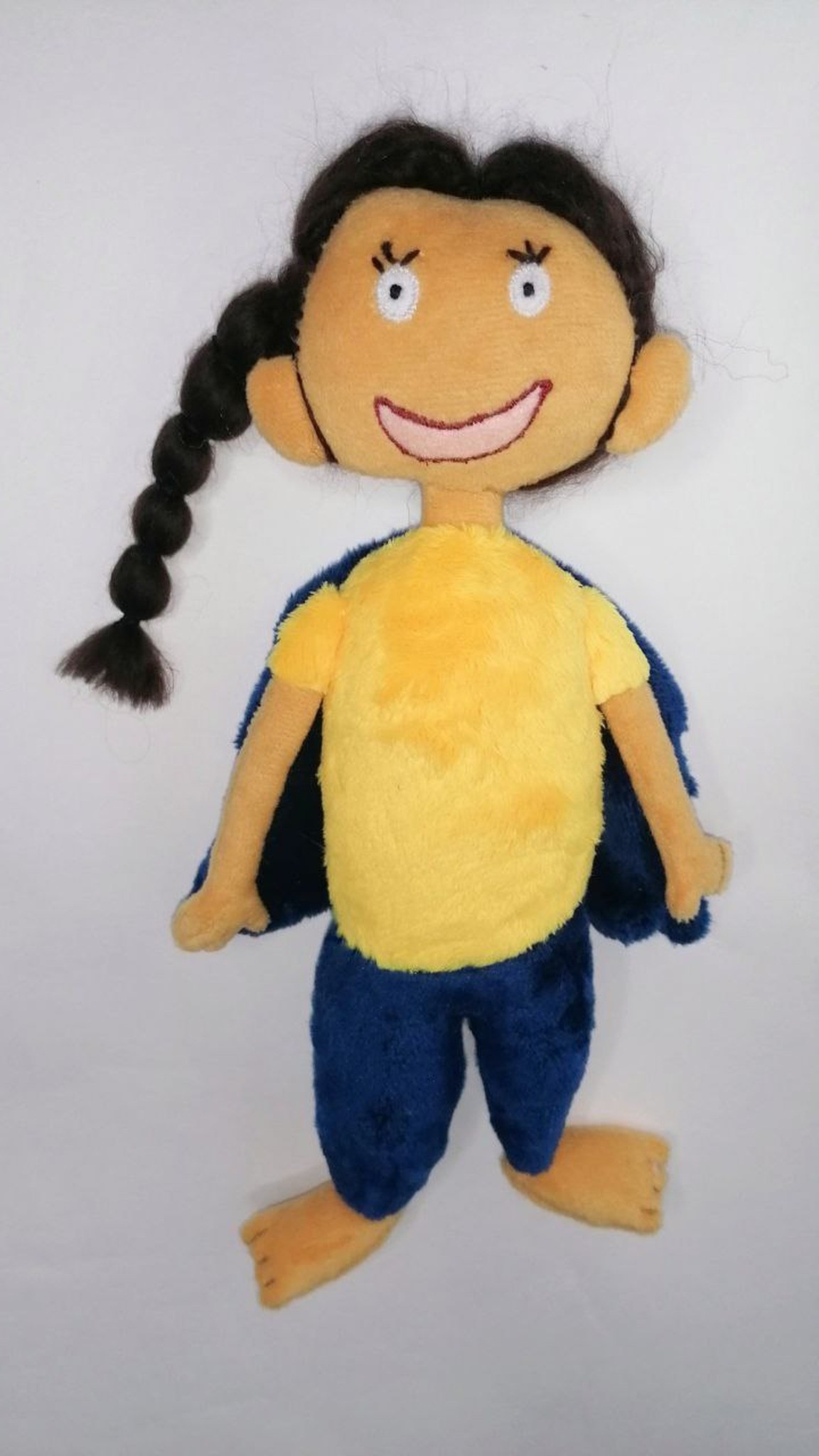 Plush girl doll with an embroidered smile, a long braid and big flat feet, made to order from a kid's drawing