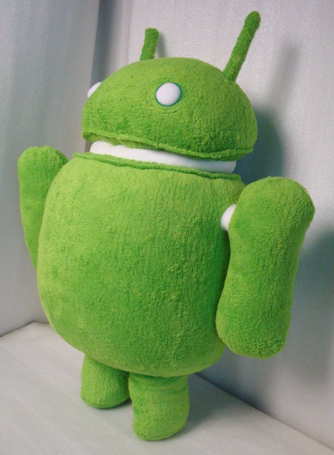 Green Android robot plush, round body Green Android robot plush turned to the side, showing its round body, separate dome head and handmade arms