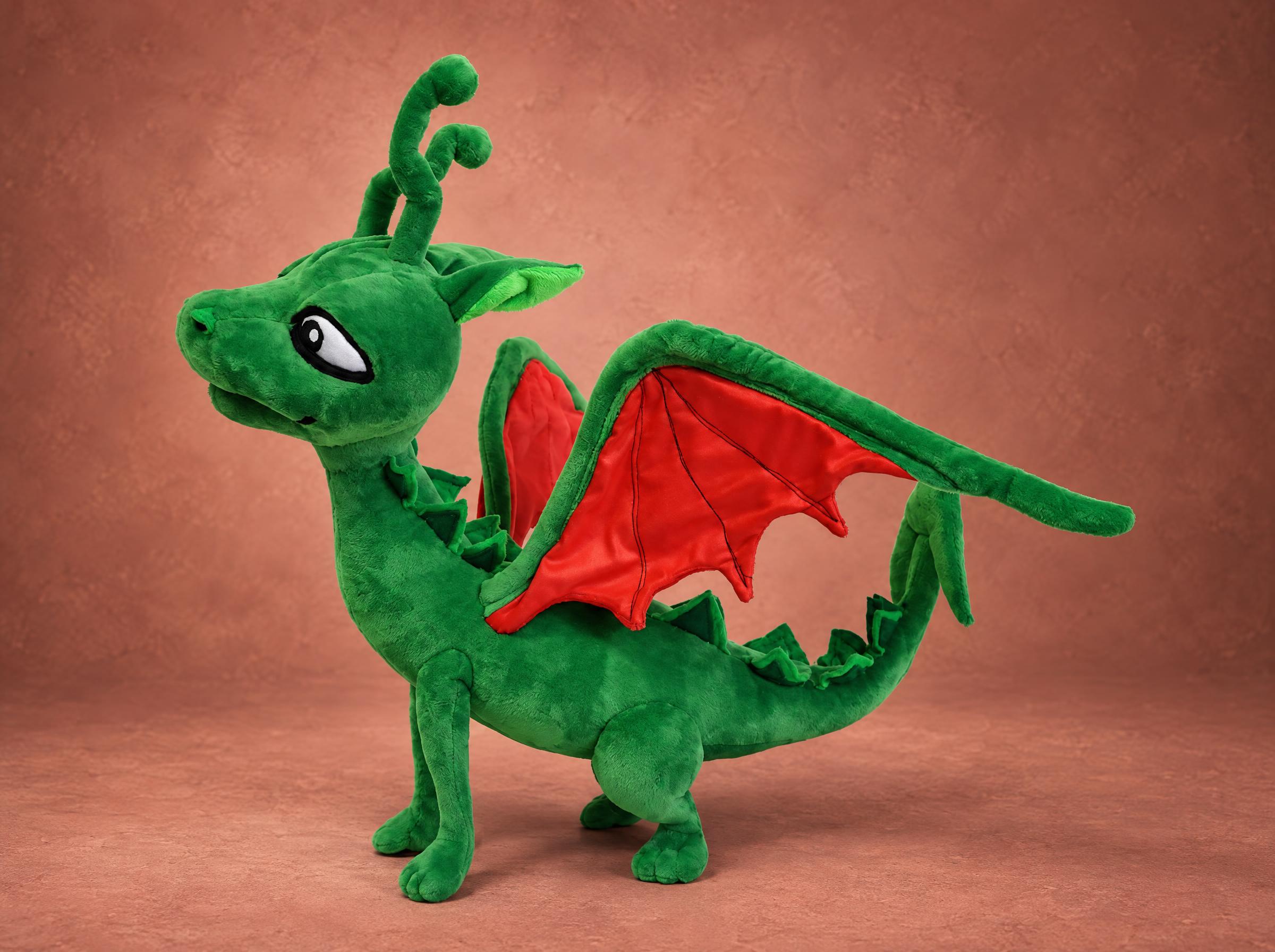 Green dragon plush with red-lined wings and two curly horns, a book dragon sewn by hand to order