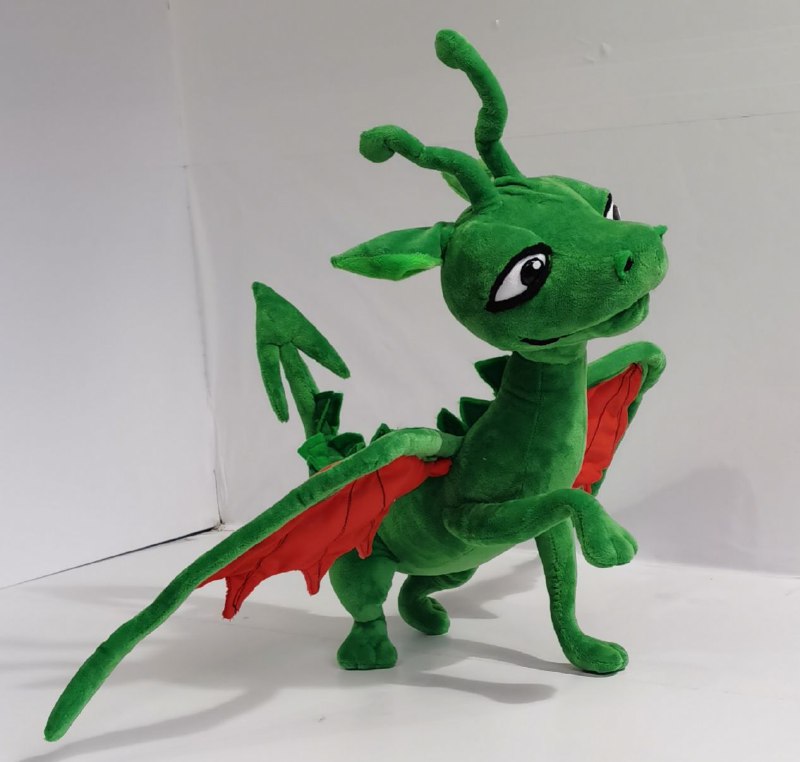 Green dragon plush with a paw raised Custom green dragon plush lifting one front paw, red wing lining and curly horns, sewn by hand to order