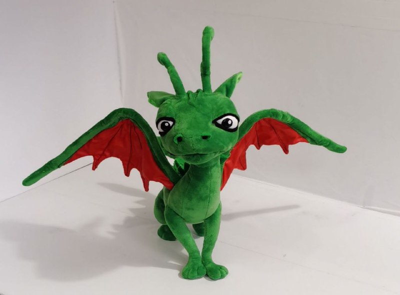 Green dragon plush with wings spread Green book dragon plush with both red-lined wings spread wide, big eyes and curly horns, made to order