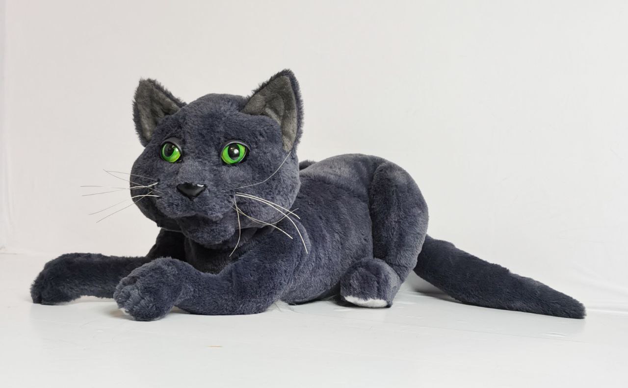 Grey cat plush toy with a long tail Grey cat plush toy sewn to order from a customer's cat photos, lying low with a long tail stretched out