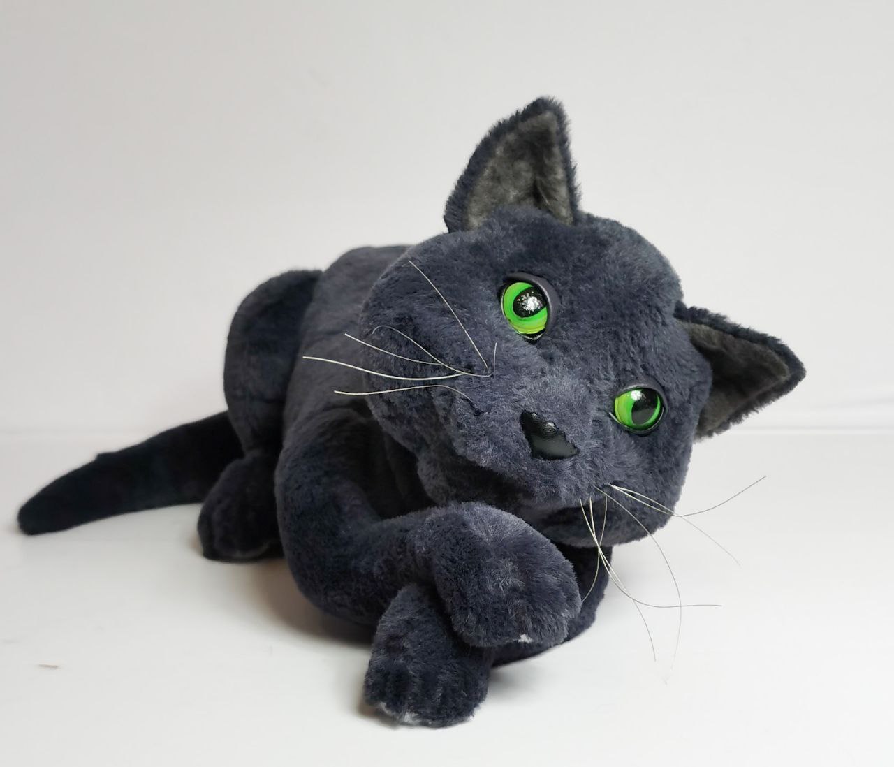 Grey cat stuffed animal from pet photos Grey cat stuffed animal made from pet photos, green eyes and a crossed front paw, sewn by hand to order