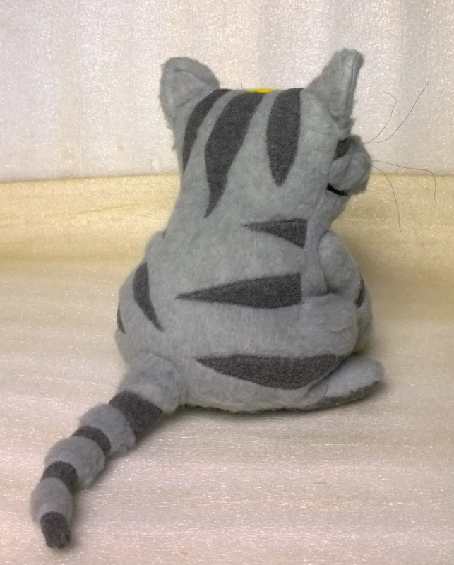 Grey tabby cat plush with striped tail Grey tabby cat plush with dark stripes down his back and a long striped tail, handmade to order from a drawing