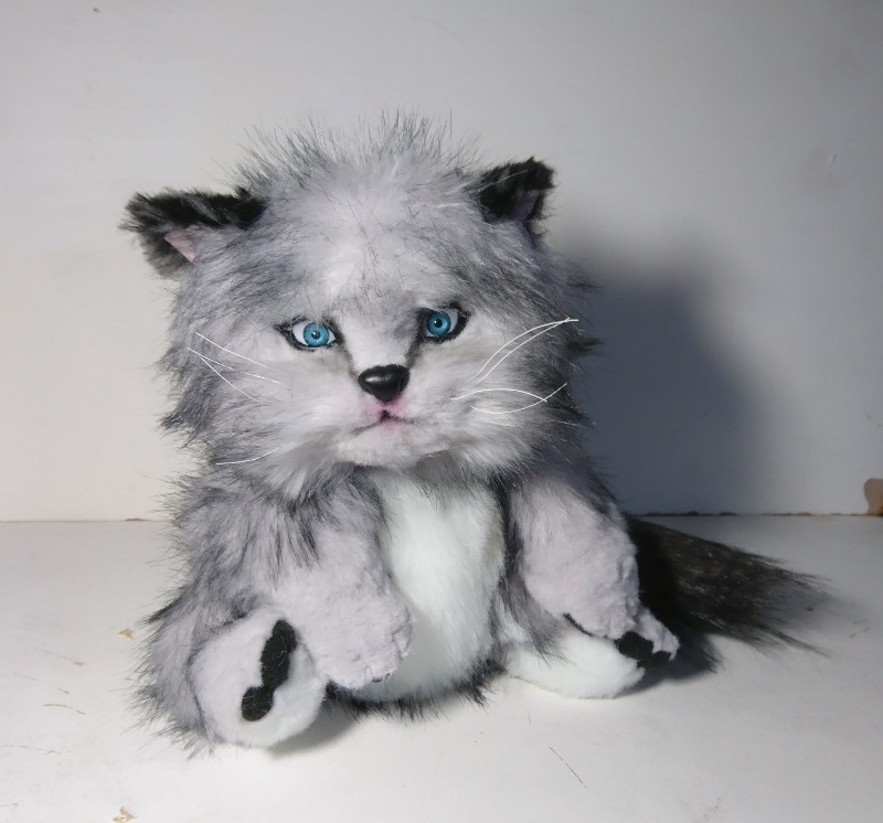 Realistic grumpy kitten plush Realistic grumpy kitten plush in grey, white and black faux fur, blue eyes, black nose, sewn by hand to order
