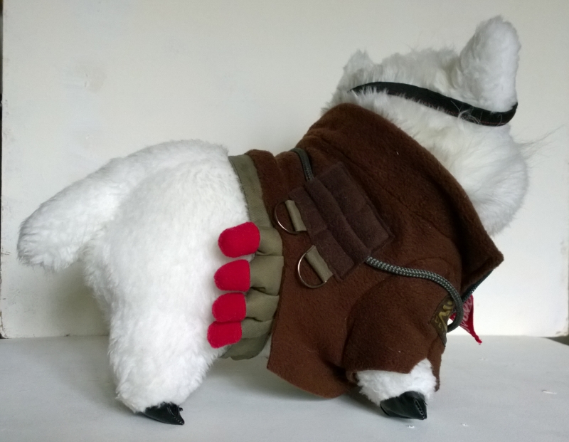 Handmade alpaca plush with a shell pouch Handmade alpaca plush sewn to order, fluffy white tail and a pouch of red shells on its brown jacket