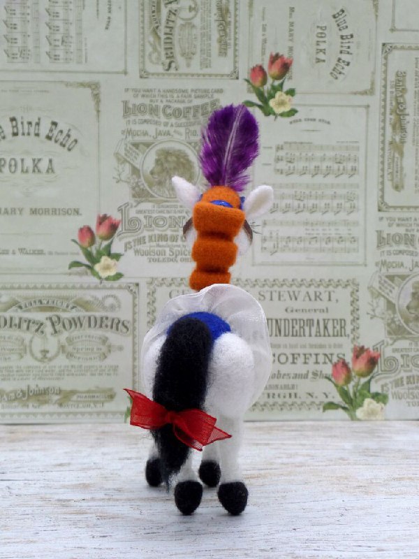 Handmade circus horse plush with a red bow Handmade circus horse plush Angela made to order, orange curls down the neck, a red bow on the black tail