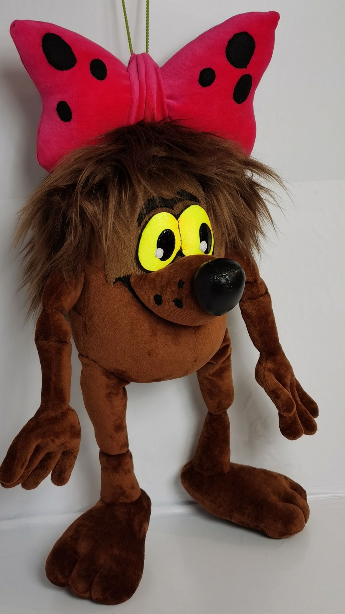 Handmade Dyudyuka Soviet cartoon plush, made to order: round brown body, thin limbs and a pink polka-dot bow