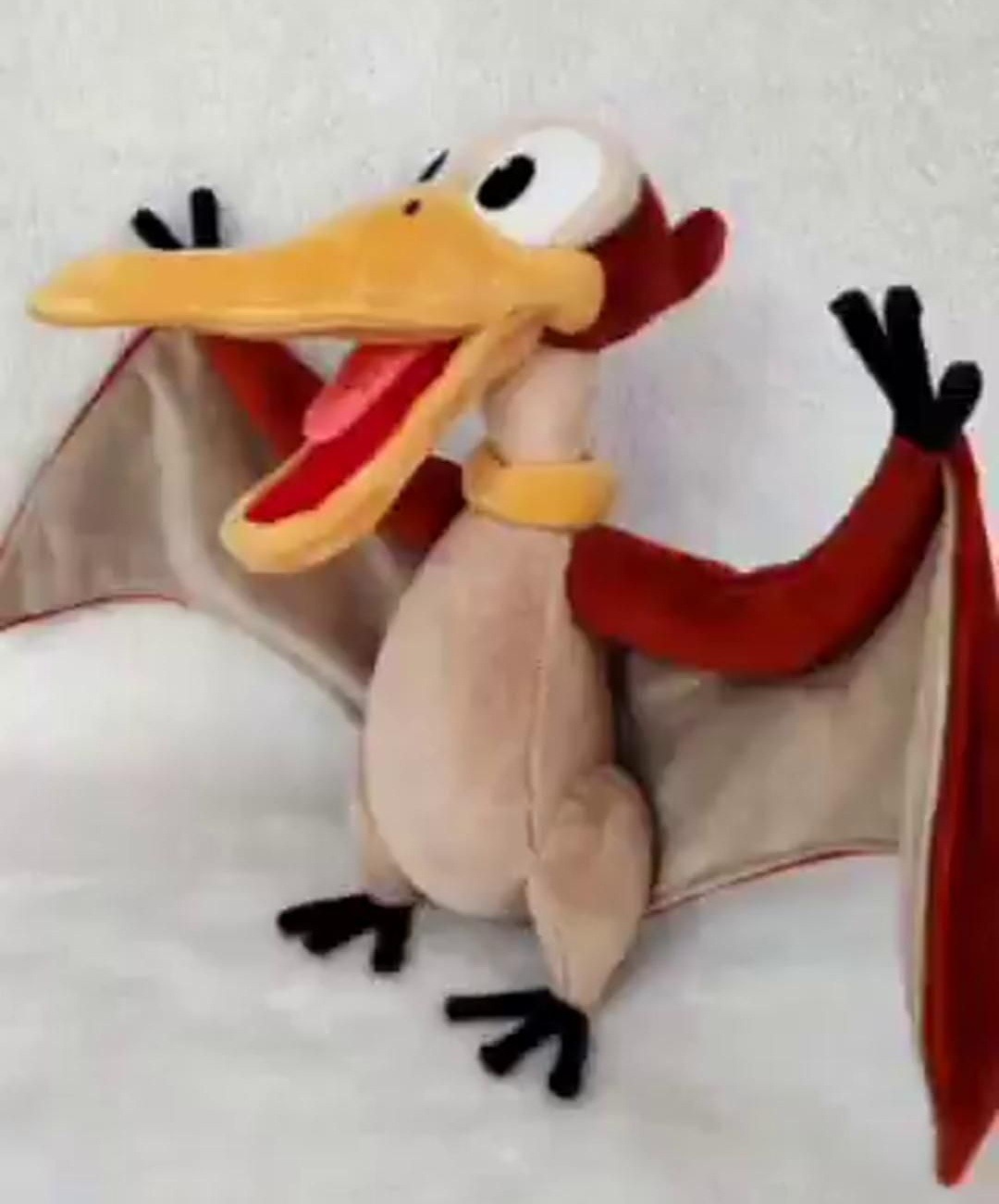 Petrie plush with his wings spread Land Before Time Petrie plush standing on black three-toed feet with both wings spread, custom made by hand