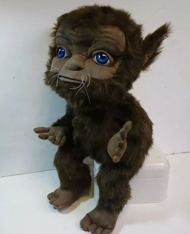 Poltergeist creature plush with blue eyes Custom poltergeist creature plush with brown faux fur, blue eyes and big flat feet, sewn by hand from a drawing