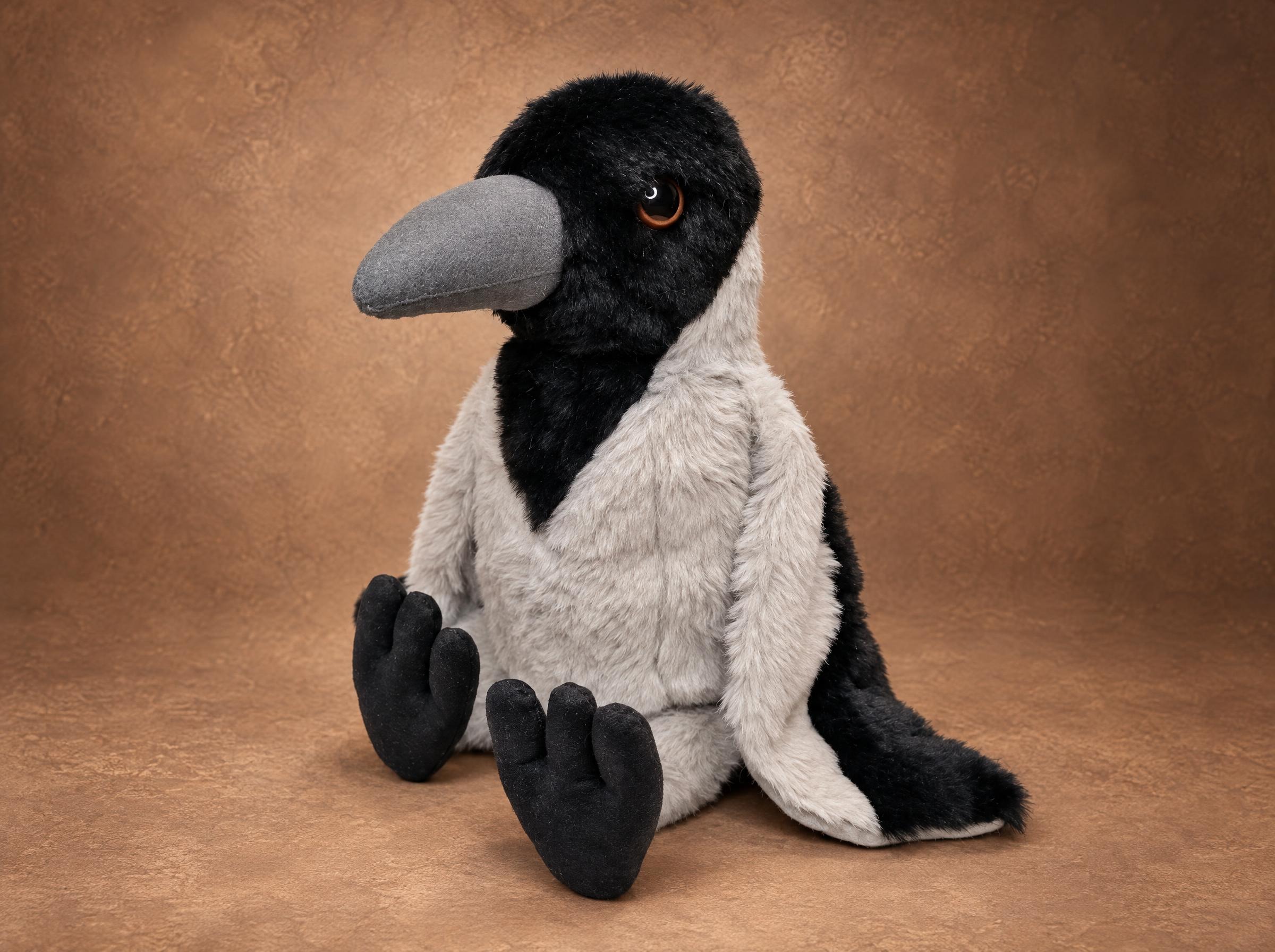 Hooded crow plush in grey and black faux fur with a long grey beak, sewn by hand to order as a copy