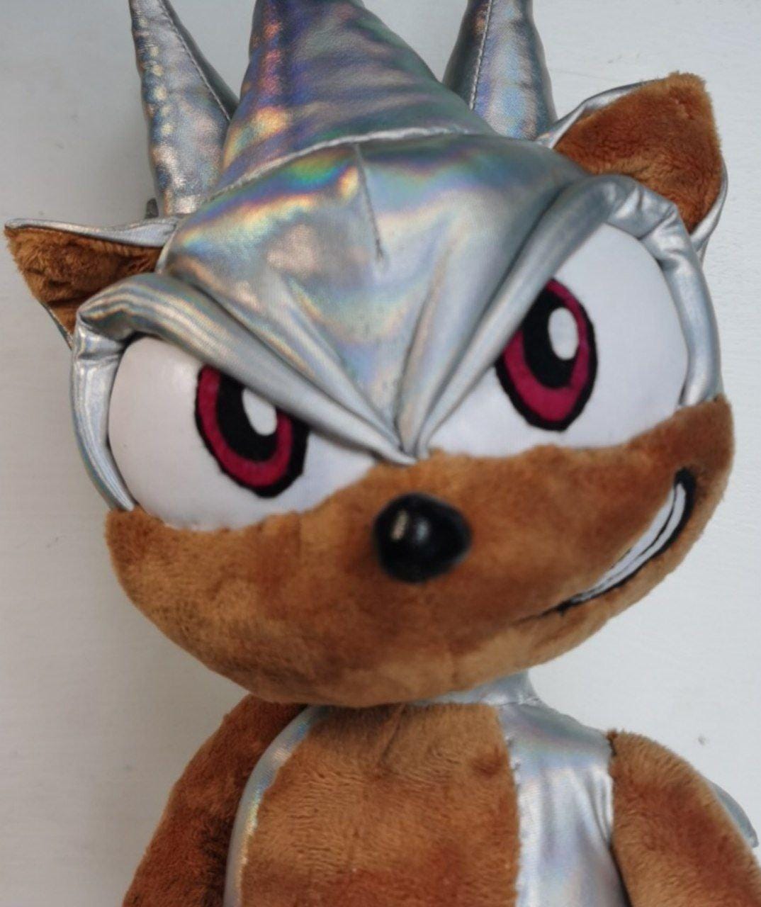 Hyper Sonic plushie face Hyper Sonic plushie with holographic silver quills and magenta eyes, a custom Sonic plush sewn to order