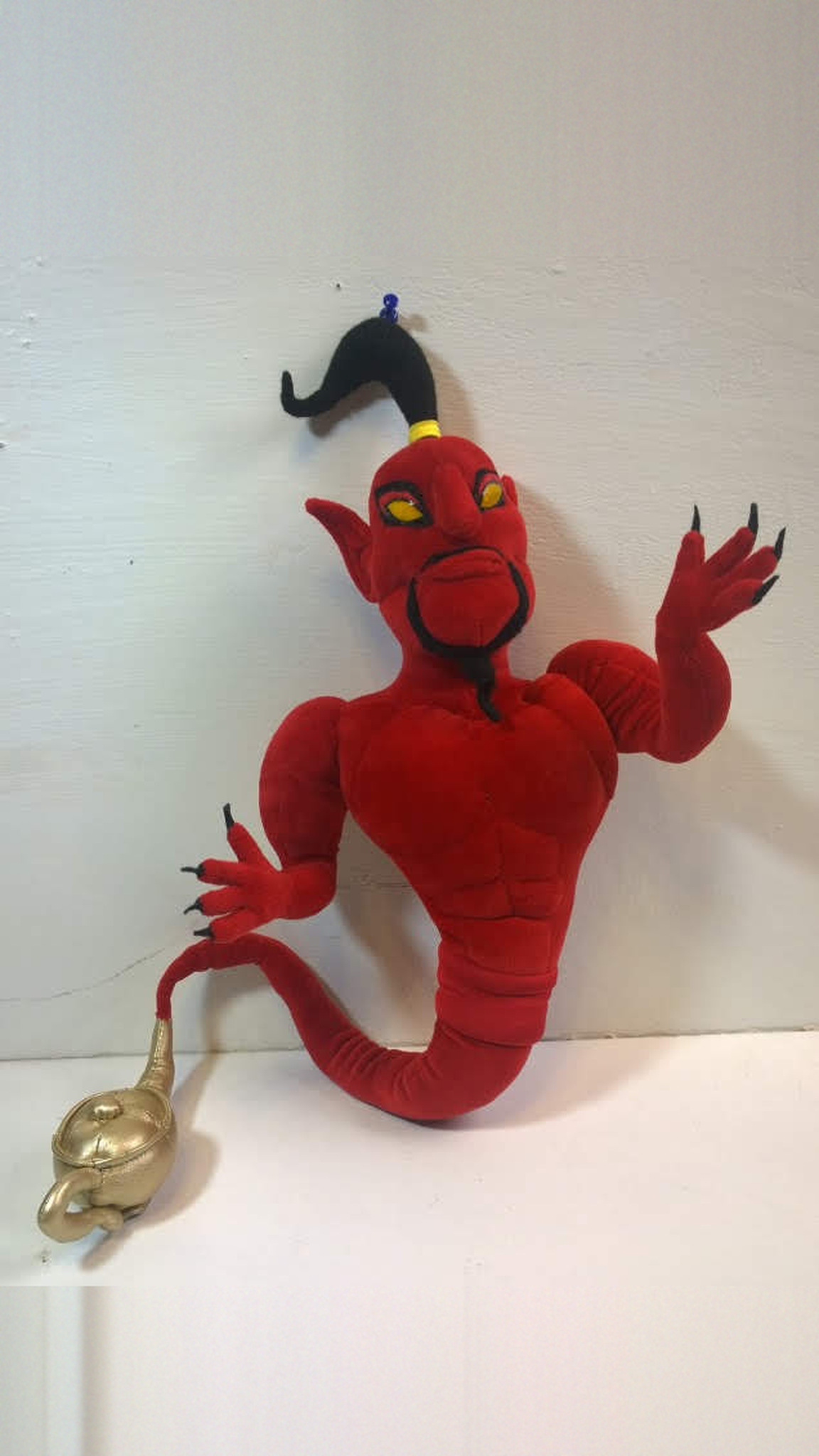 Jafar genie plush in red with a scowl, black claws and a golden lamp at the end of his tail, custom made