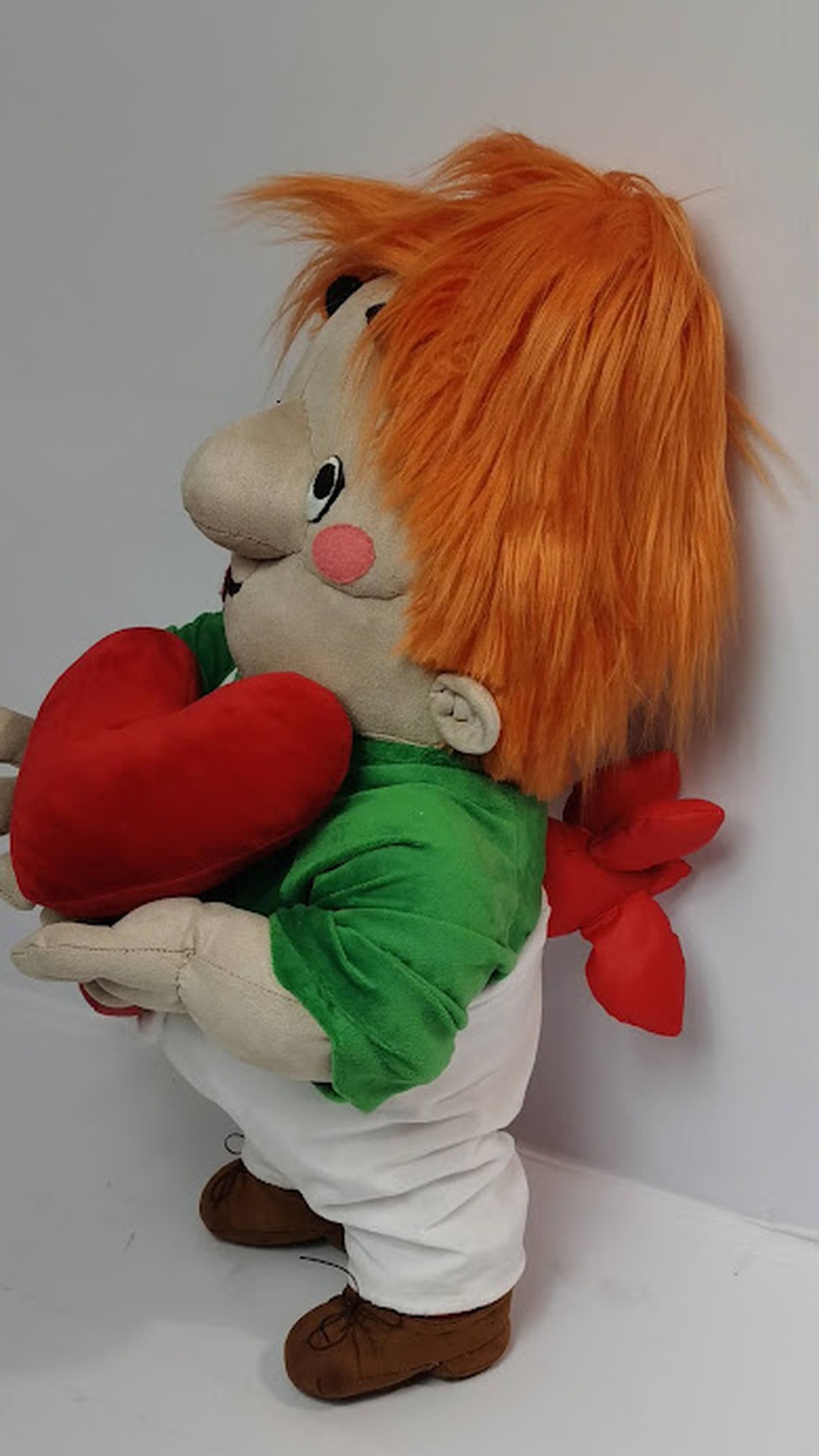 Karlsson-on-the-Roof toy made to order, hugging a red plush heart, his propeller showing behind