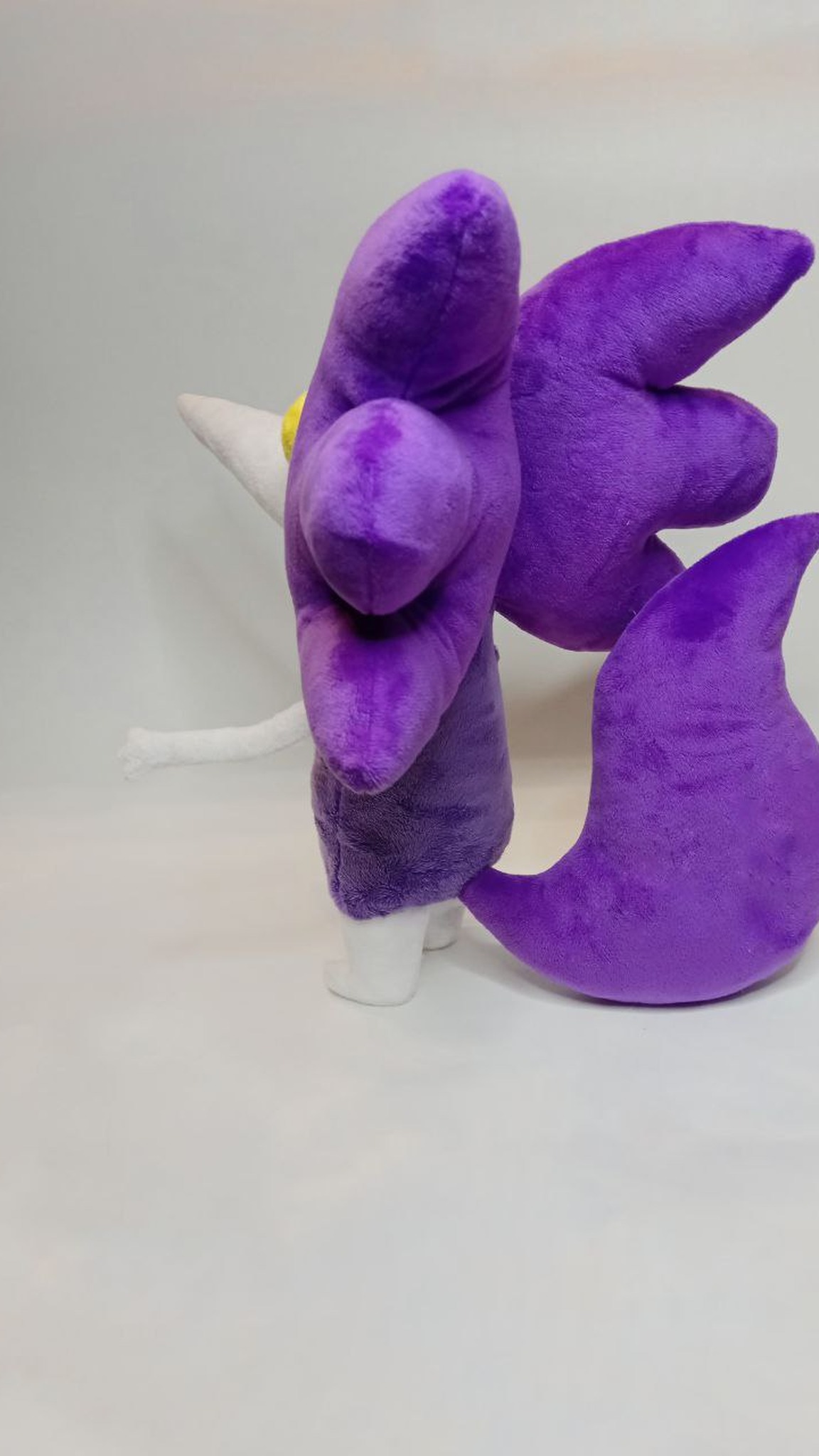 Kloggi plush crest and curled purple tail, a custom plush handmade to order from a kid's drawing