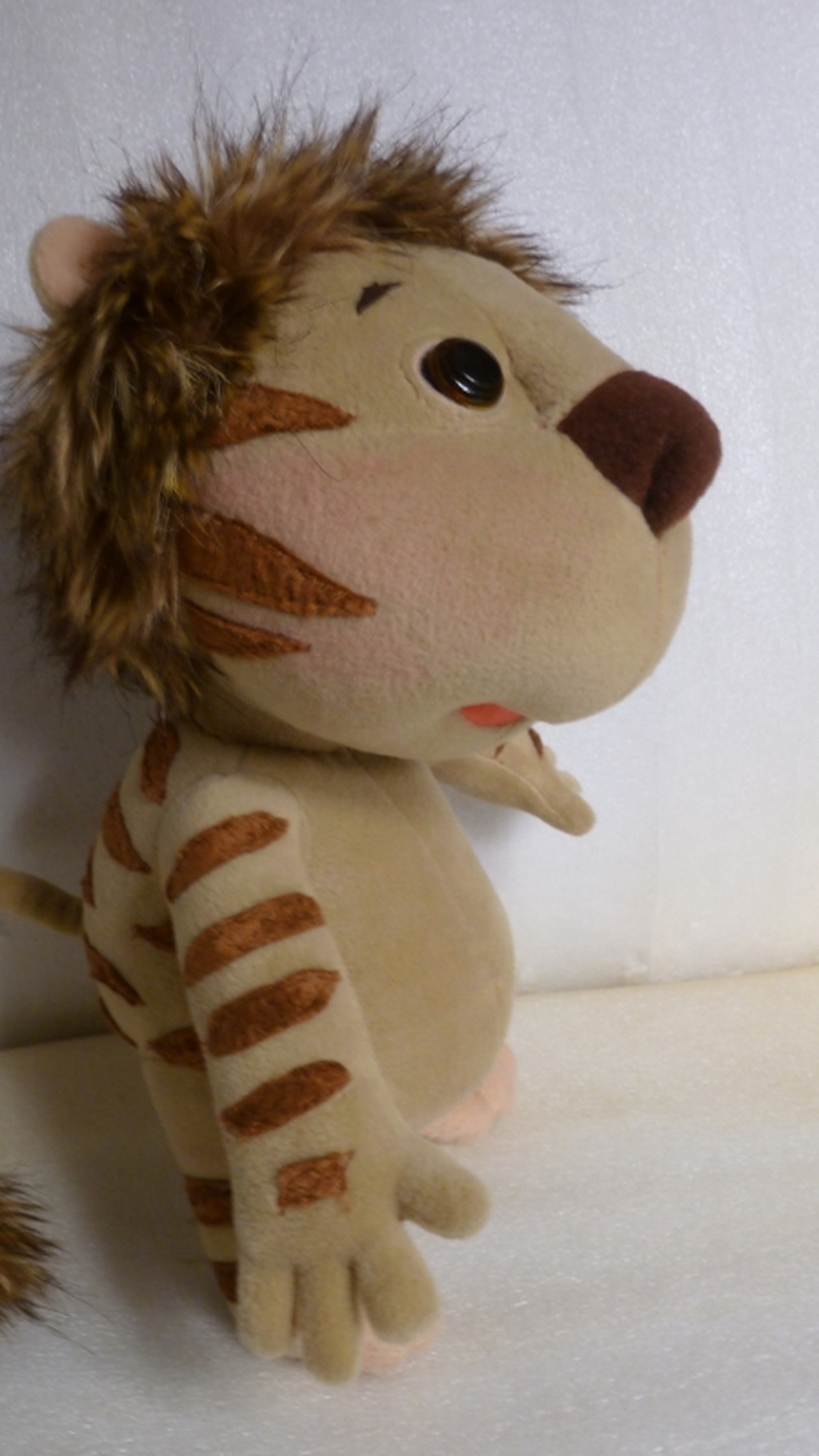 Lala liger plush from Yugo & Lala with a long tail and faux fur tuft, striped cheeks and arms, made to order