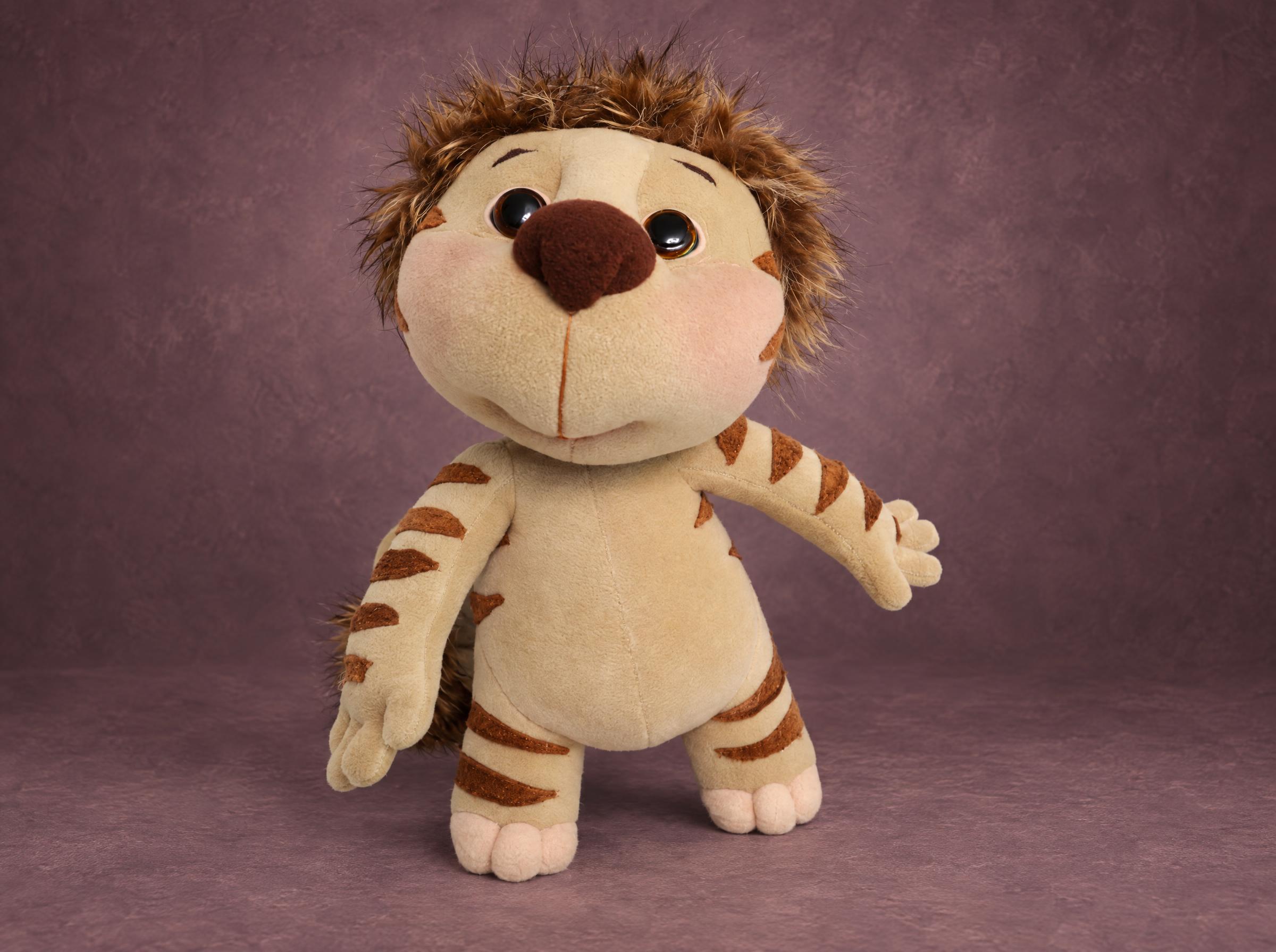 Lala tiger cub plush from Yugo & Lala with a shaggy faux fur mane and striped arms, handmade to order