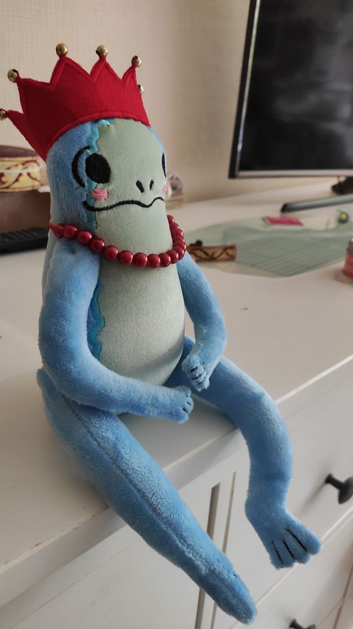 Lanky blue frog plush with very long legs and a red crown, frog princess sticker toy made to order