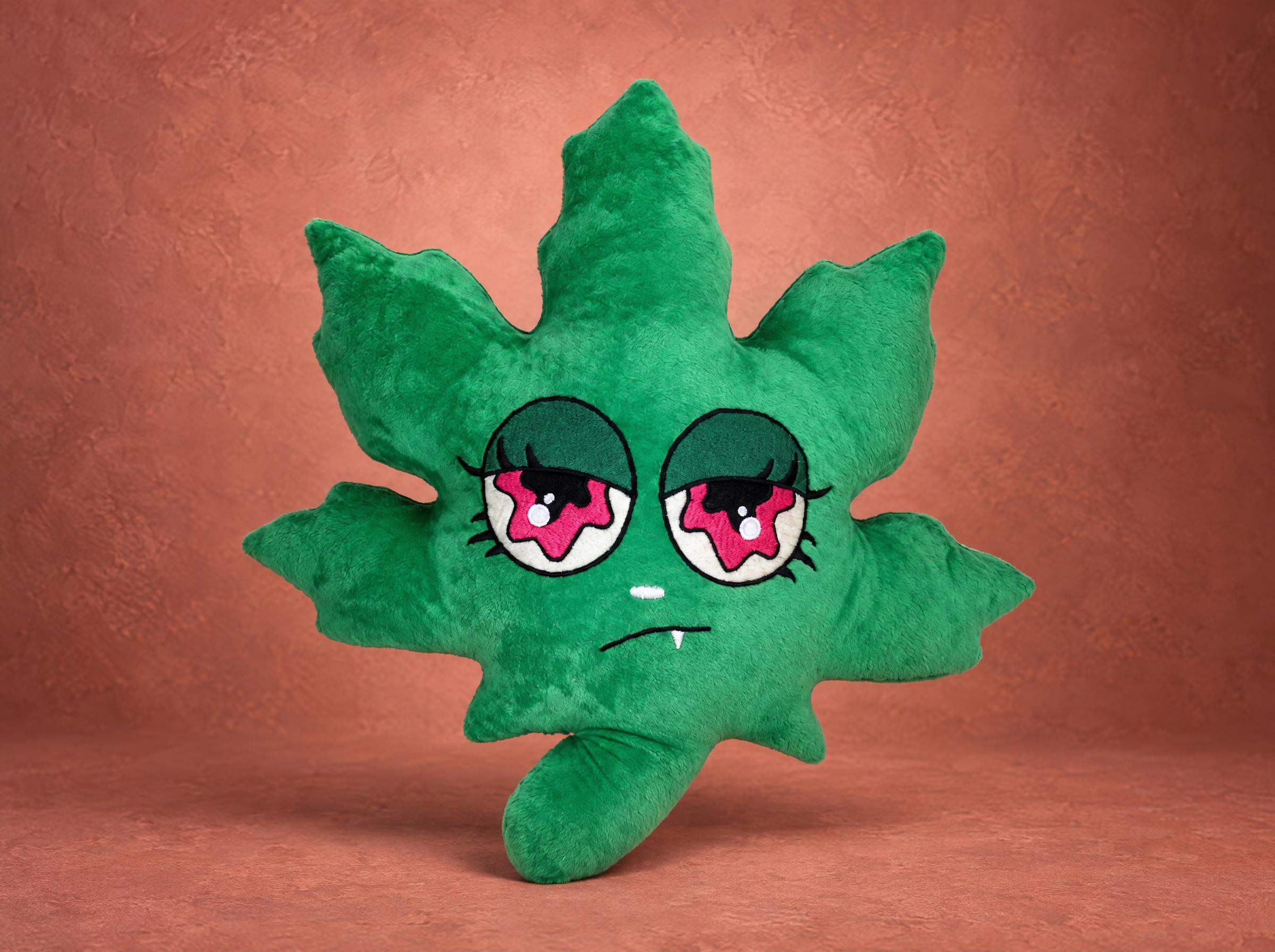 Pot leaf plush made to order: green plush leaf with sleepy pink eyes, a small white fang and a curved stem