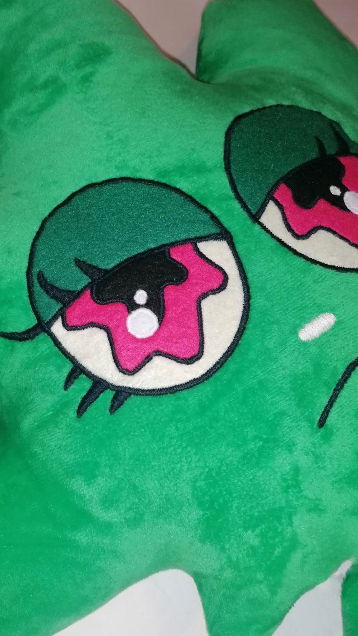 Pot leaf plush eyes, handmade to order: sewn-on fabric, pink irises, green lids, dark stitched outlines