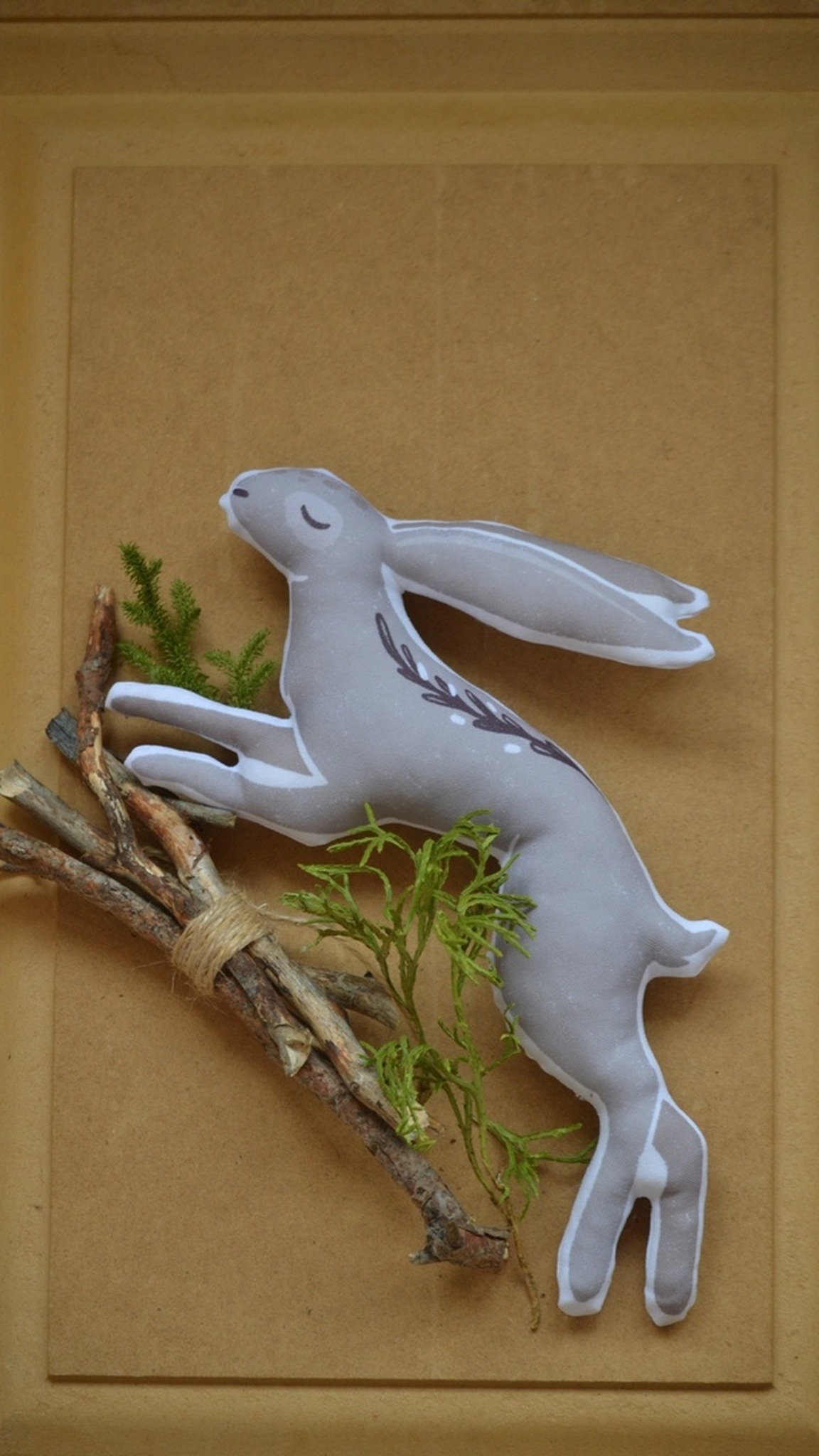 Leaping hare plush pillow with closed eyes and ears swept back, custom shaped from artwork, made to order