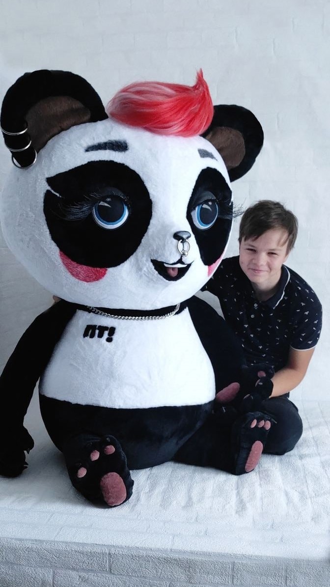 Life-size panda mascot plush Life-size panda mascot plush next to a boy for scale, 140 cm tall, sewn to order for a TV channel