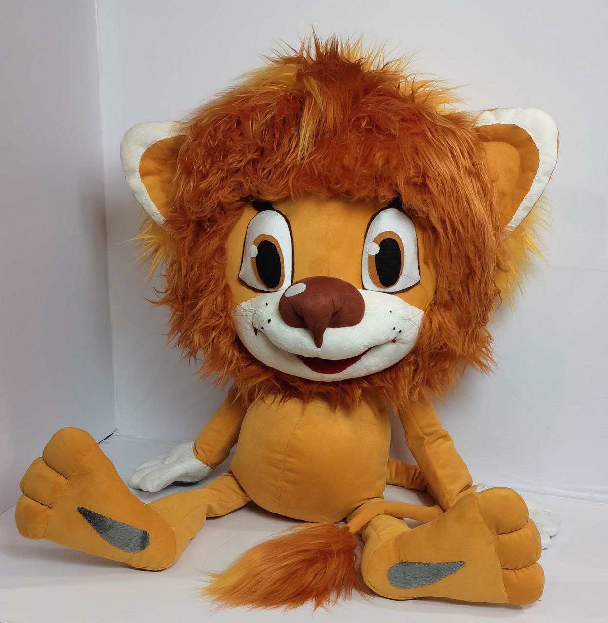 Lion cub plush with amber eyes Lion cub plush with amber-brown eyes, shaggy ginger mane and grey sole pads, custom Soviet cartoon cub