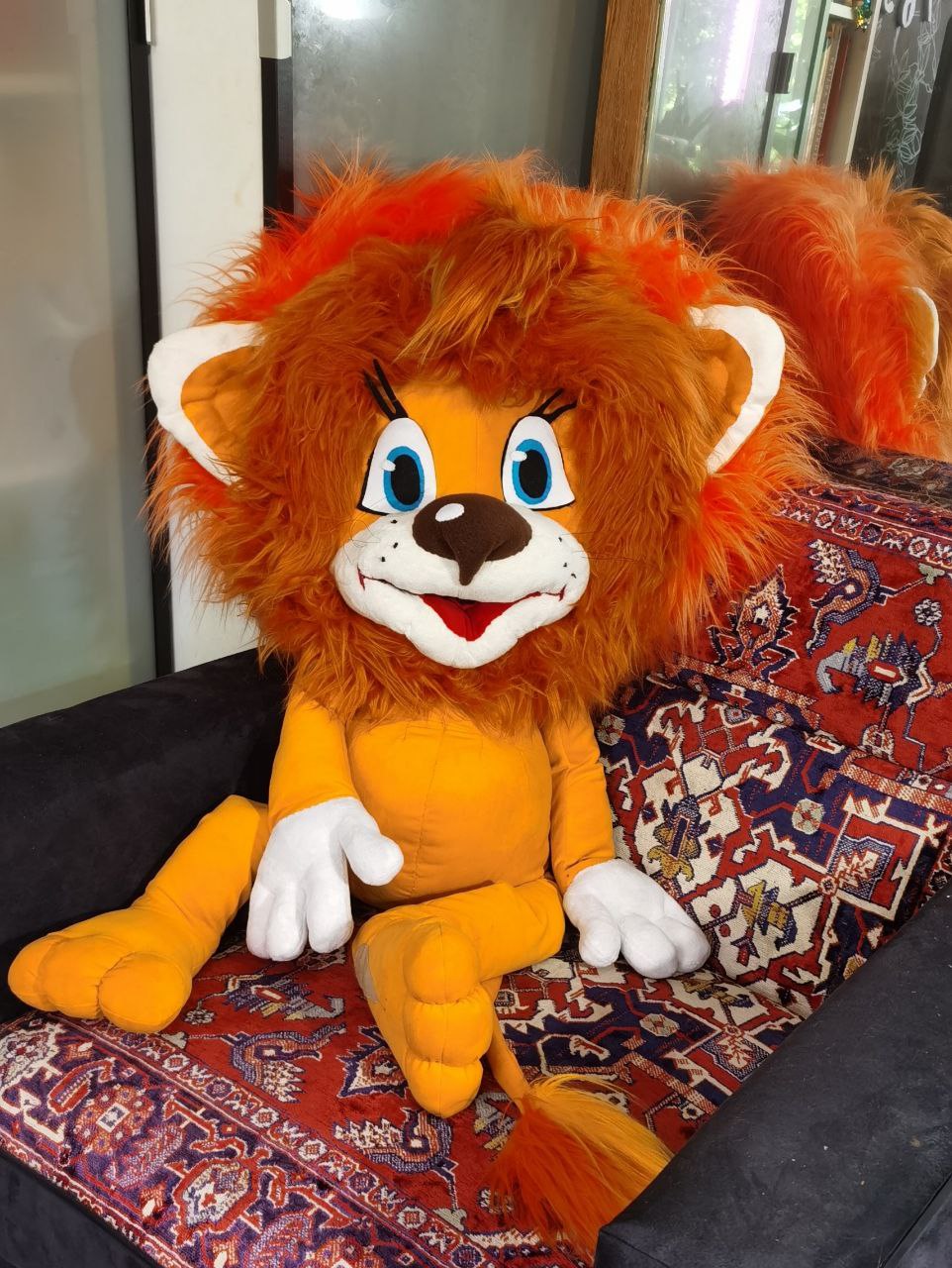 Giant lion cub plush in an armchair Giant lion cub plush taking a whole armchair, Soviet cartoon cub with orange faux fur mane, sewn to order
