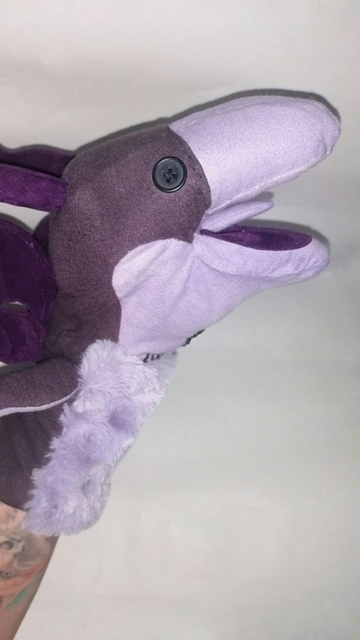 Lockheed dragon puppet with its mouth open, purple lining, four bat wings and lilac faux fur, handmade fan piece