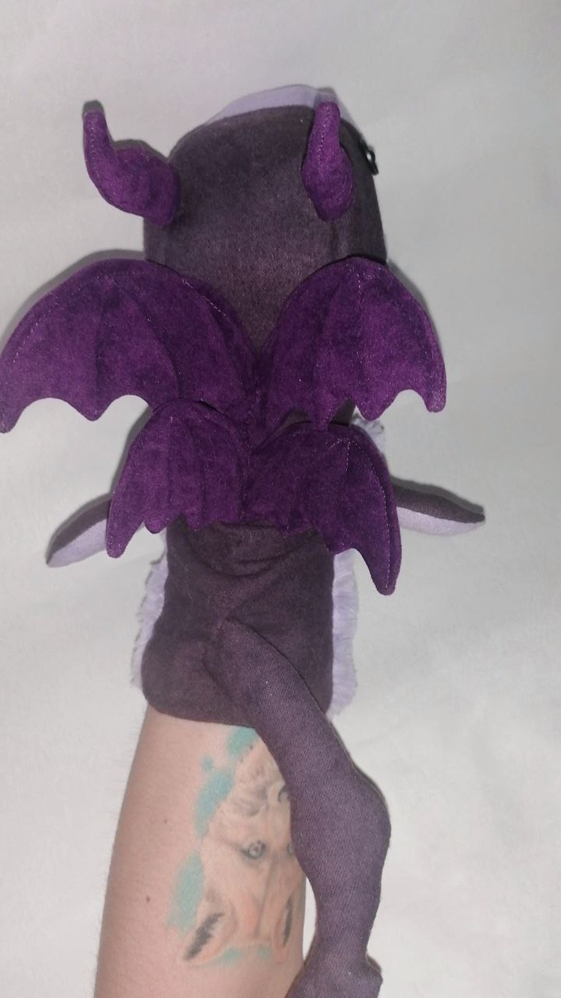 Marvel Lockheed dragon puppet with two pairs of purple velvet-like bat wings, horns and a long tail, handmade