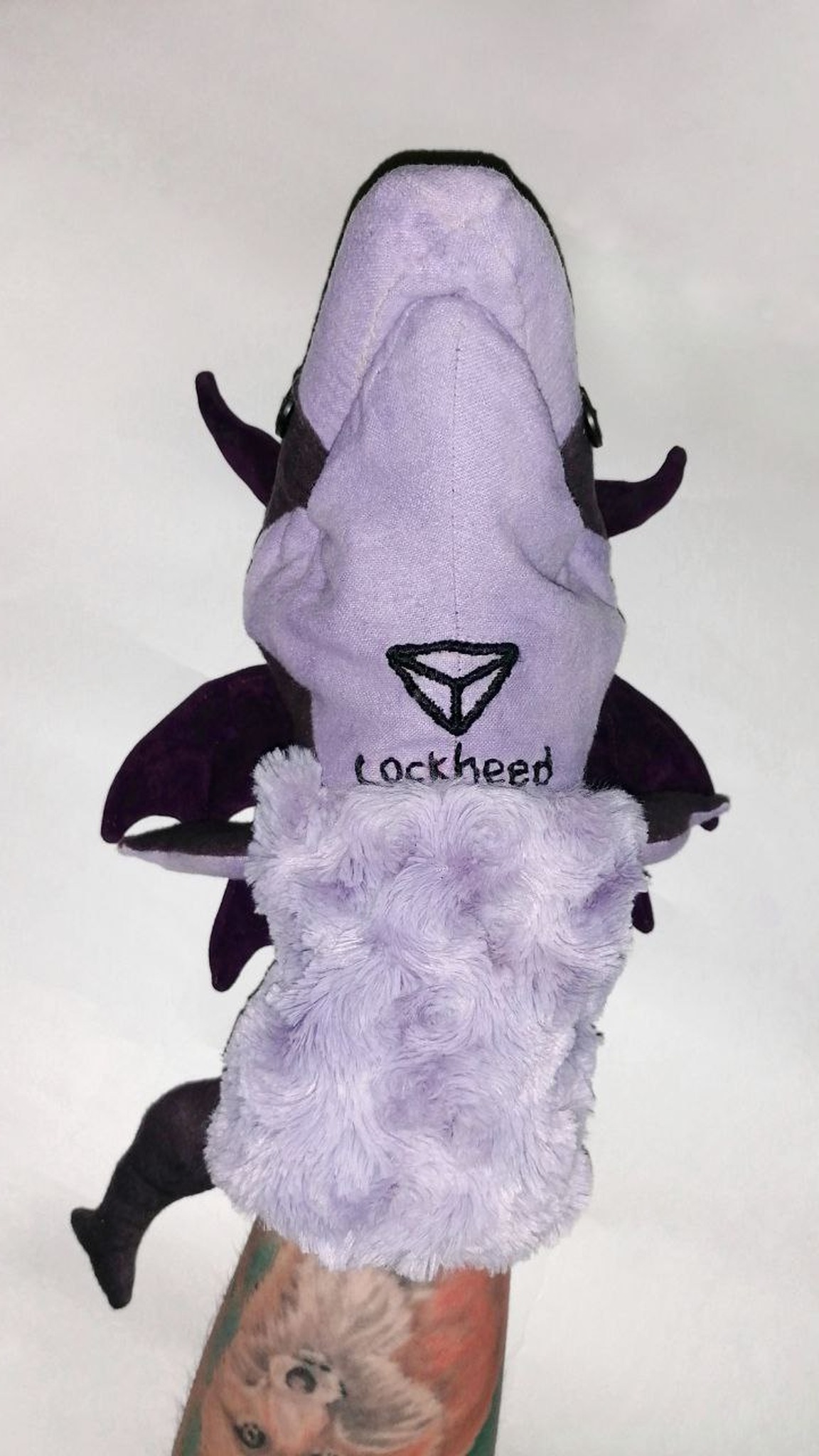 Custom Lockheed puppet with his name and a symbol embroidered under the lilac chin, sewn to order