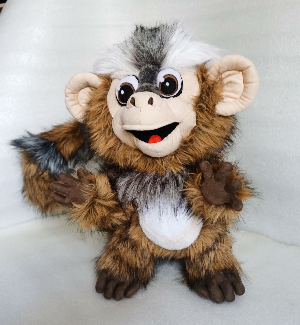 Marmoset plush with big eyes Marmoset plush with big cartoon eyes, open grin and a white belly, sewn by hand for one client