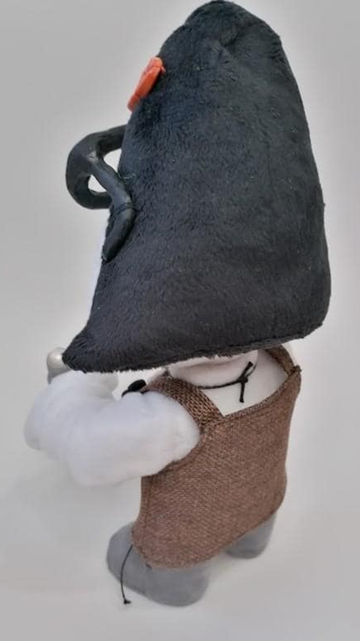 Mary Daisy Dinkle doll with black faux-fur hair, orange clip and brown apron dress, Mary and Max doll to order