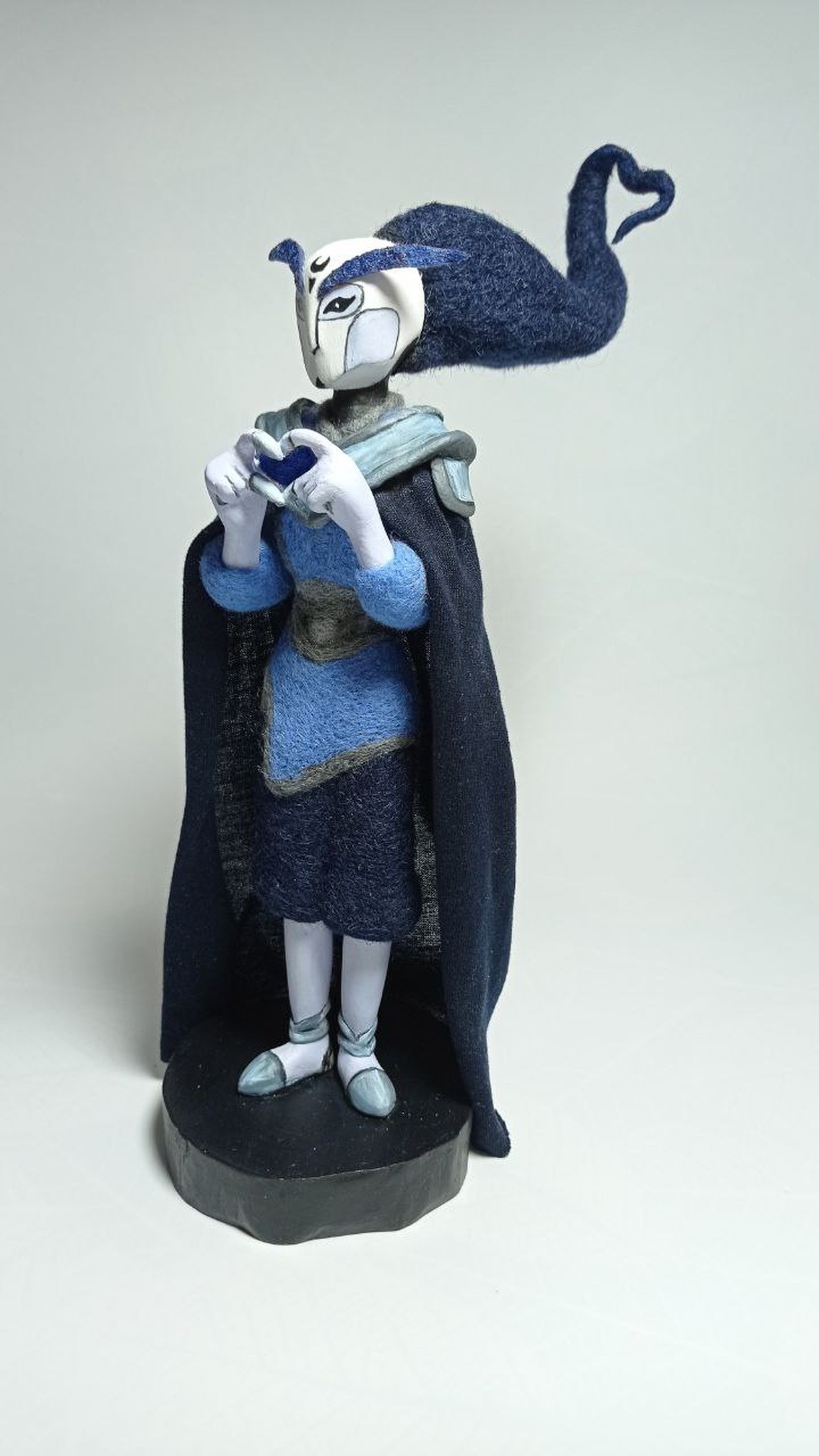 Needle-felted anime OC doll Midnighter with heart hands and a long navy cape, handmade to order