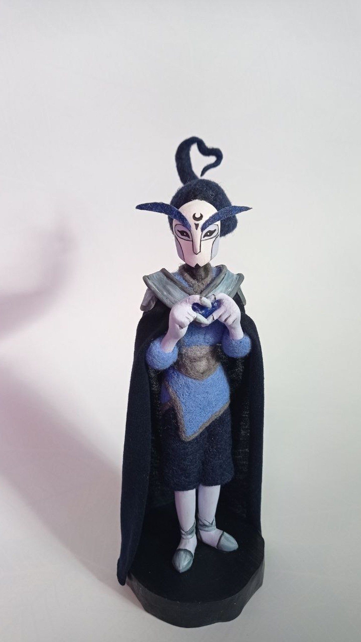 Custom OC doll with a hand-painted white mask and crescent moon mark, made to order from art