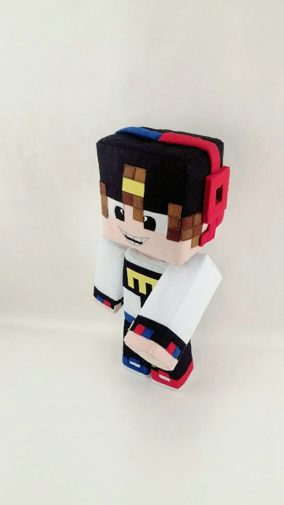Minecraft skin plush boy with a raised box arm and a big grin, handmade to order