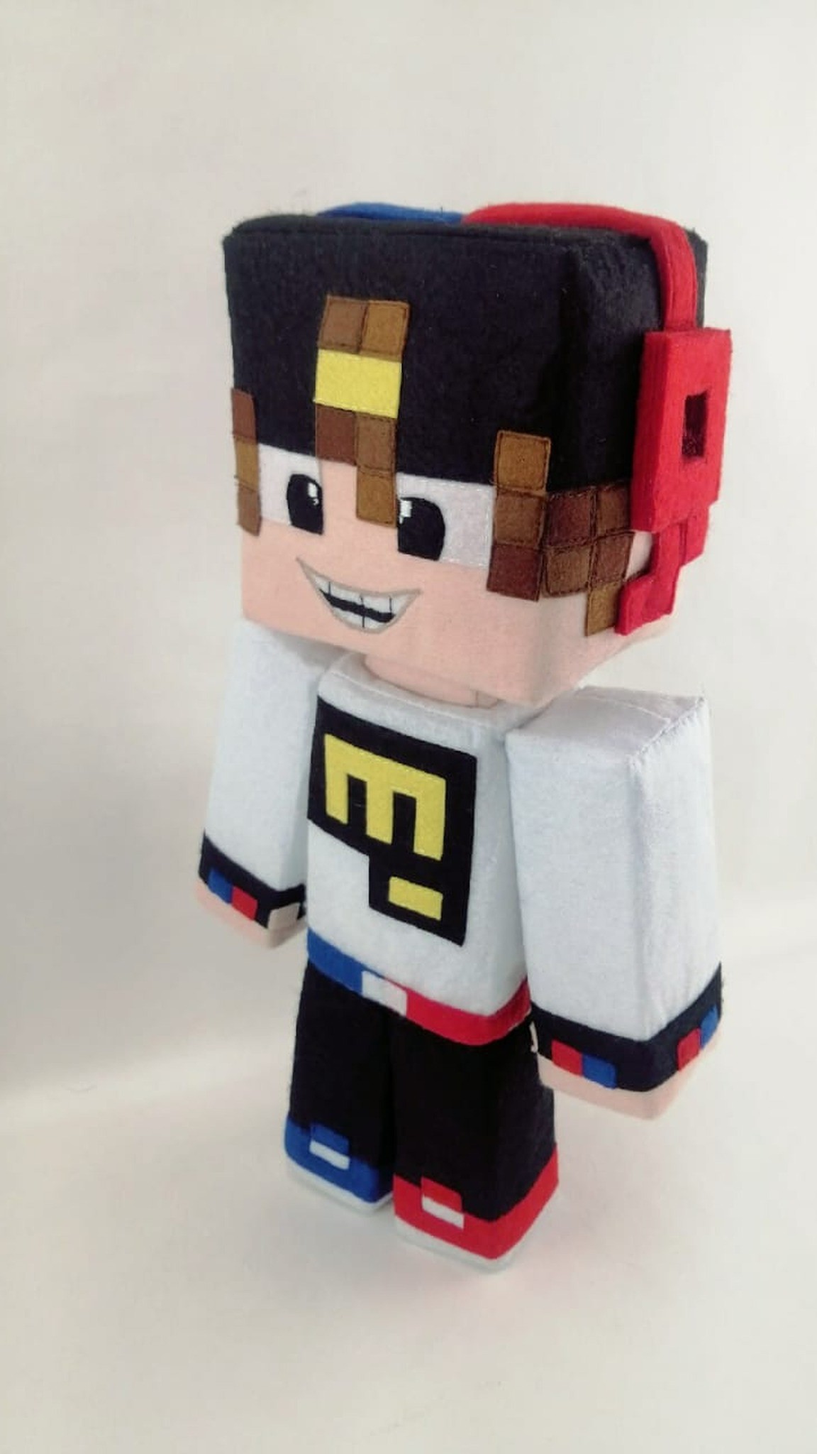 Minecraft skin plush with a felt pixel face and blue and red headset, made to order from a skin