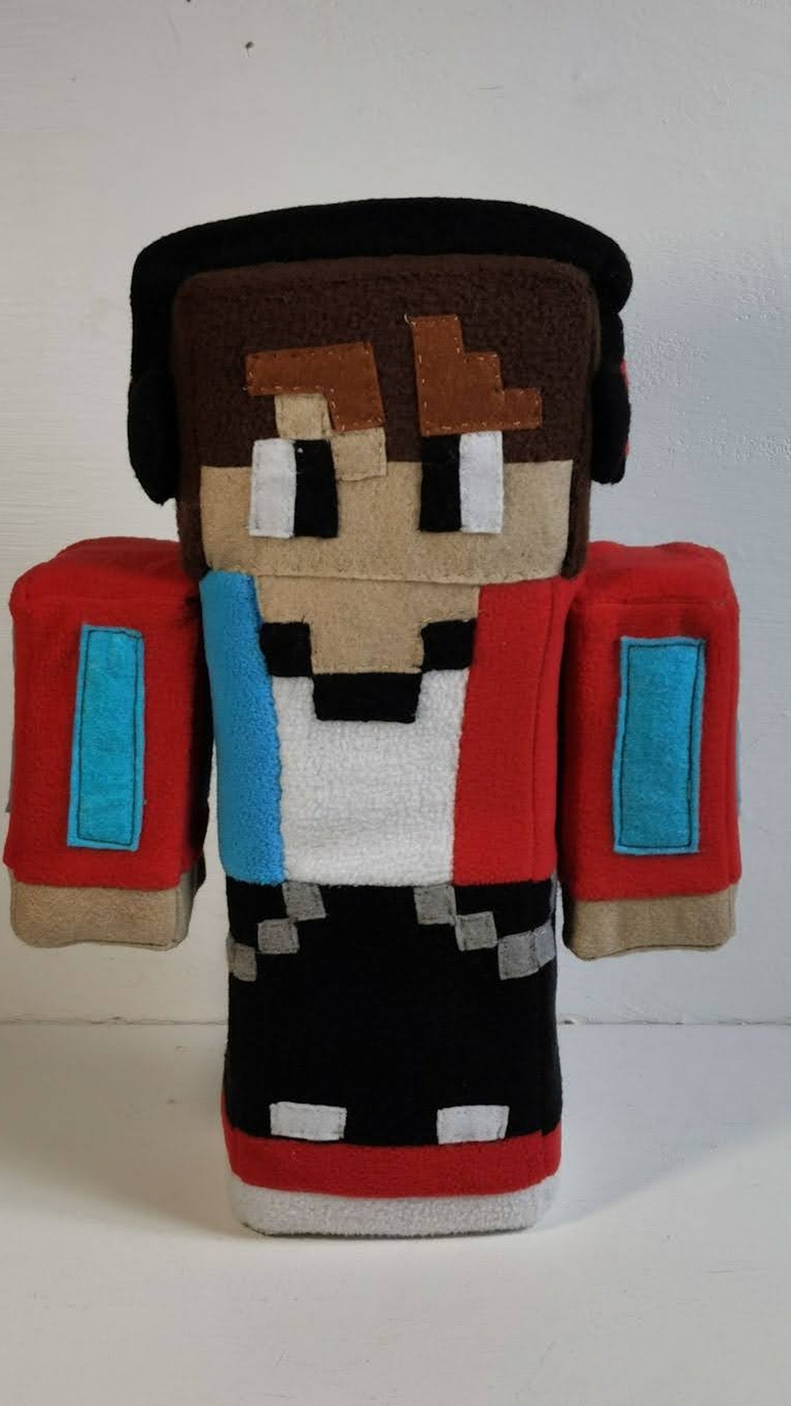 Minecraft skin plush in a red jacket with light blue stripes and black headphones, made to order