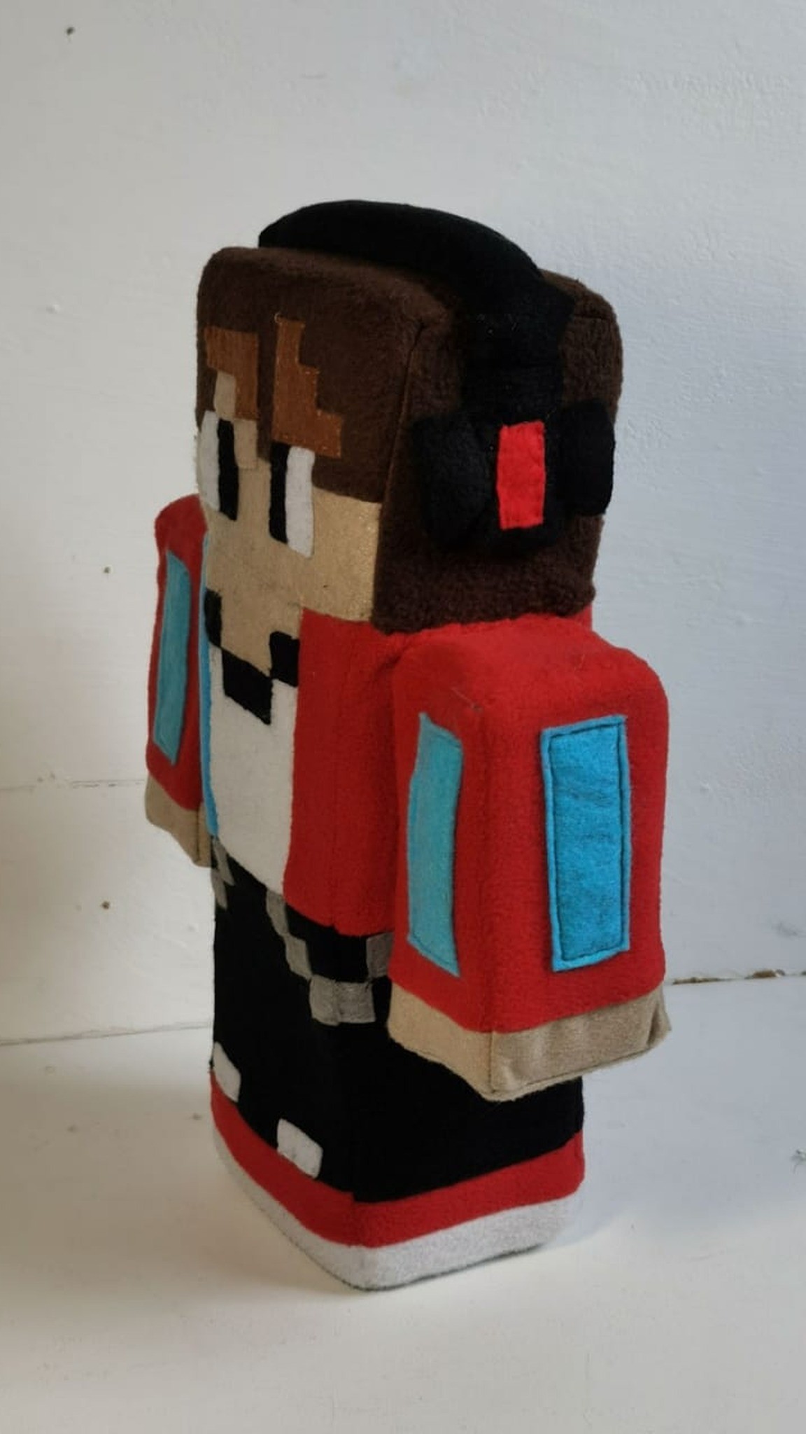 Blocky Minecraft skin plush with a cube head, headphones and red jacket, sewn to order