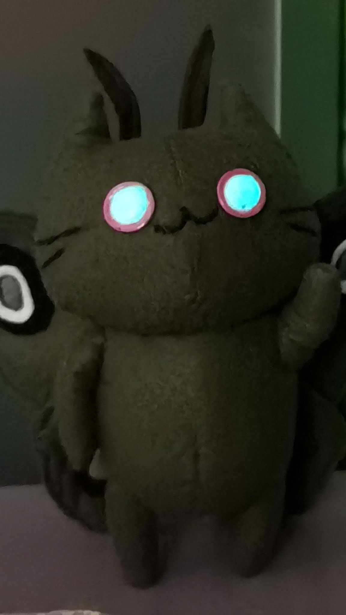 Handmade moth cat plush with eyes glowing blue-green in the dark, original creature made to order