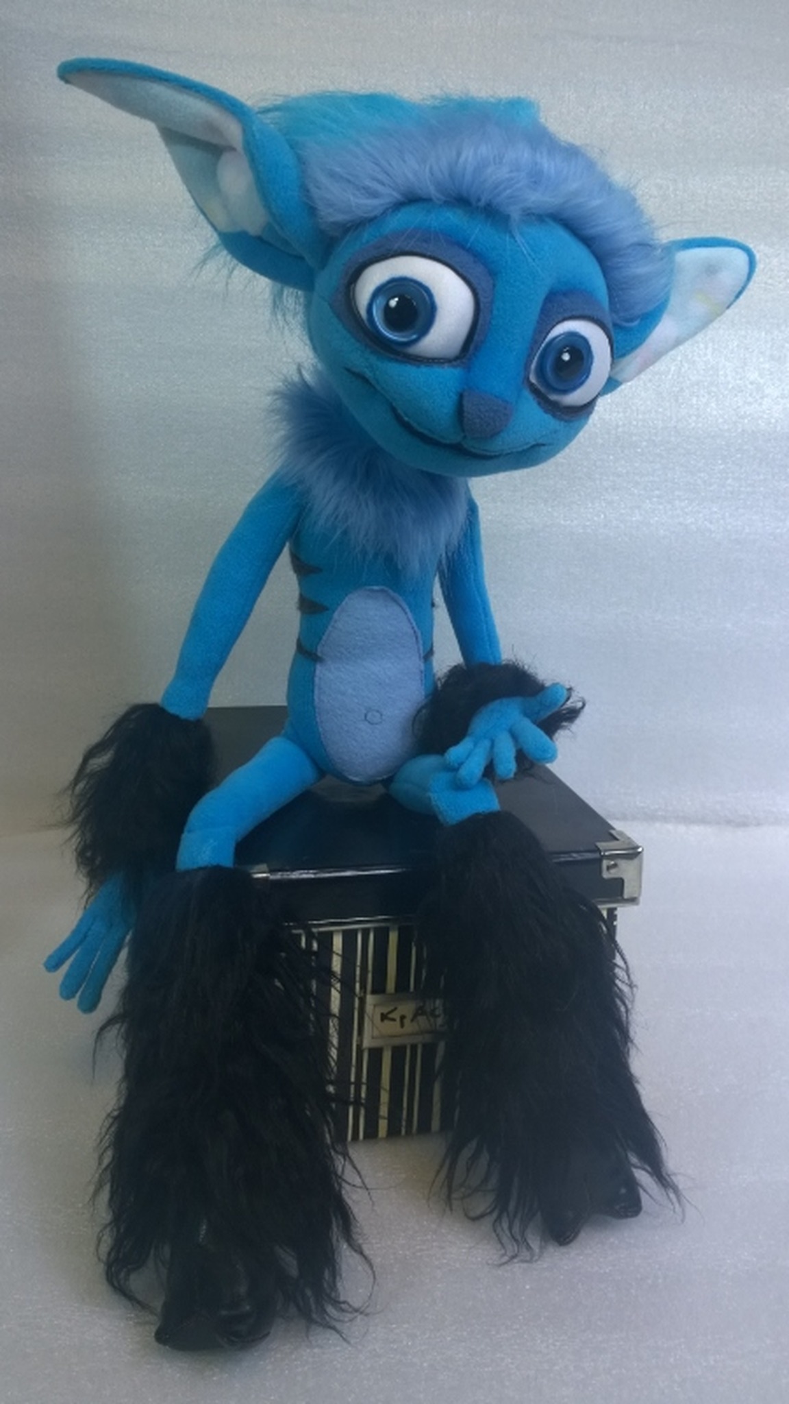 Mune Guardian of the Moon plush with a blue faux fur collar and black furry faun legs, custom made to order