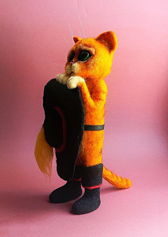 Needle felted Puss in Boots from Shrek Needle felted Puss in Boots from Shrek holding his hat, orange wool, black boots and whiskers, handmade to order