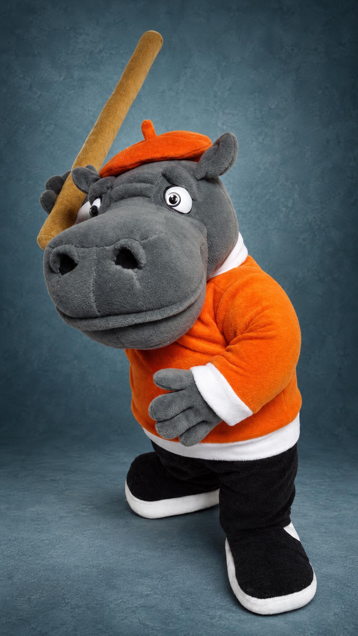Grey hippo plush from Nu, Pogodi! holding a cane like a bat, custom made in an orange beret and sweater
