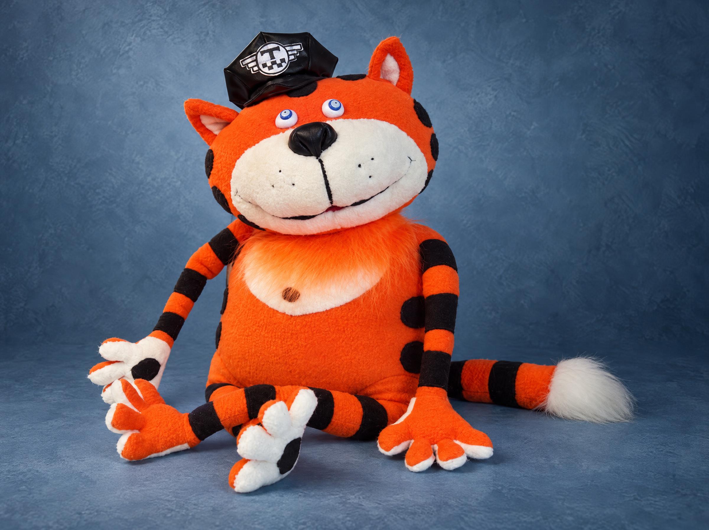 Orange striped cat plush in a black taxi driver's cap, handmade to order from a drawing